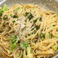 Creamy Fettuccine Alfredo And Broccoli  · With broccoli. Creamy Alfredo sauce roasted garlic and broccoli loaded with Parmesan cheese.