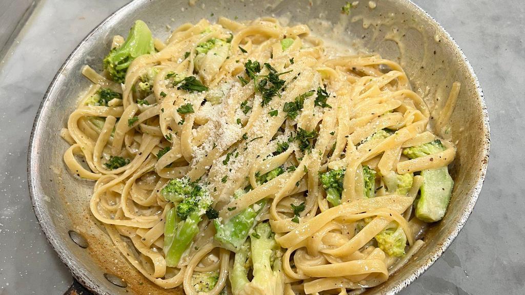 Creamy Fettuccine Alfredo And Broccoli  · With broccoli. Creamy Alfredo sauce roasted garlic and broccoli loaded with Parmesan cheese.