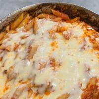 Baked Ziti · Baked dish. penne pasta smothered in ricotta cheese and marinara sauce topped with melted mo...