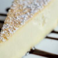 Slice Of Cheesecake · New York Style Cheese cake with drizzled Hershey chocolate!