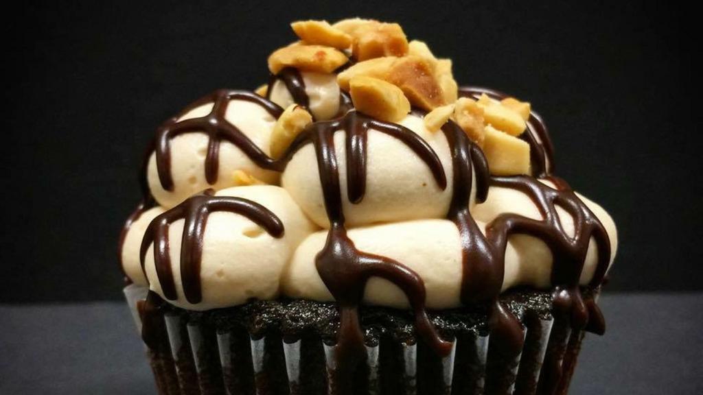 Gluttony (Classic) · Favorite. Dark chocolate-chocolate chip cake, salted caramel filling, peanut butter frosting, chocolate ganache drizzle, roasted peanuts.