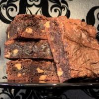 Gluttony Brownie · 1/2 lb. slice. Dark chocolate - chip brownie marbled with salted caramel, peanut butter chip...