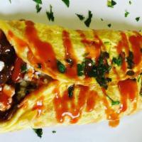 Greek Omelette · Three organic eggs, tomatoes, red onions, kalamata olives and feta cheese.