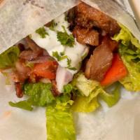 Chicken Gyro · Marinated chicken gyro meat on pita bread, green lettuce, tomatoes, red onions, and tzatziki...