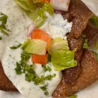 Beef & Lamb Gyro · Thin sliced beef and lamb gyro meat on pita bread, green lettuce, tomatoes, red onions, and ...