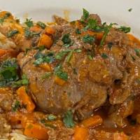 Knimi Arniou · Slow cooked lamb shank with Greek herbs served with rice or mashed potatoes.