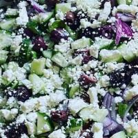 Greek Salad · Green leaf lettuce, tomatoes, cucumbers, red onions, kalamata olive, feta cheese, one dressi...