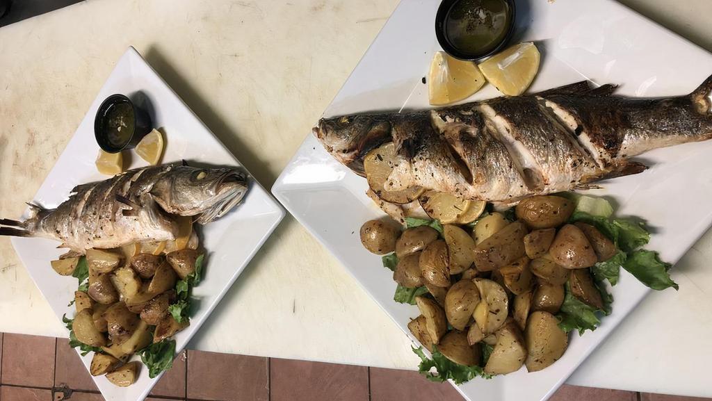 Whole Baked Bronzini · Served with choice of one side.