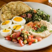 Middle Eastern Eggs · Two soft boiled eggs, hummus, tabouli, salad, zahatar pita