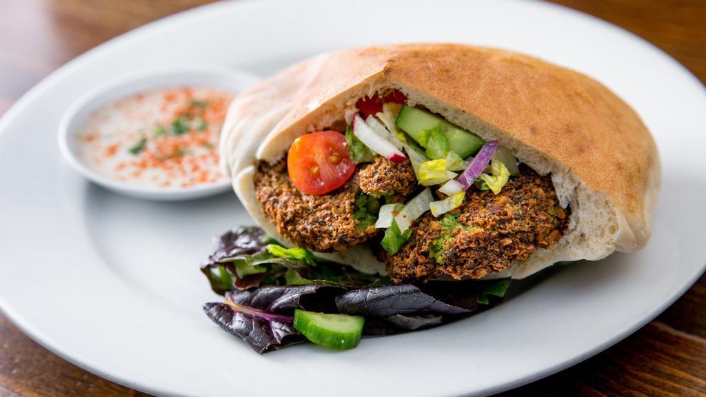 Falafel Sandwich · Falafel, hummus, tahini and salad in pita bread. Served with a choice of fries or salad.