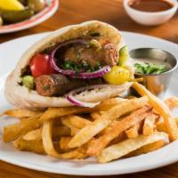 Tunisian Sandwich · Homemade Spicy Merguez Sausage, Hummus, Tahini and Salad in Pita Bread. Served with a choice...