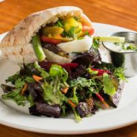 Sabich Sandwich · Eggplant and boiled egg with hummus, tahini and salad in pita bread. Served with amba and a ...