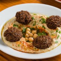 Hummus And Falafel Plate · Popular. Served with falafel, warm chickpeas, schug, tomato, onion, parsley and olive oil.