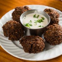 Falafel Tahini Mezze · Five pieces. Made of ground chickpeas with herbs and spices
