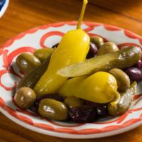 Olives & Pickles Mezze · Black Kalamata olives, green cracked olives from Lebanon, pickled cucumbers and pickled spic...