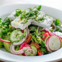 Greek Salad · Romaine, cucumber, tomato, red onion, feta cheese, fresh herbs, zahatar croutons, extra virg...