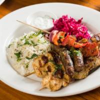 Mixed Grill · Skewers of chicken kebab, kefta kebab, veggies and merguez sausage, served with basmati rice...
