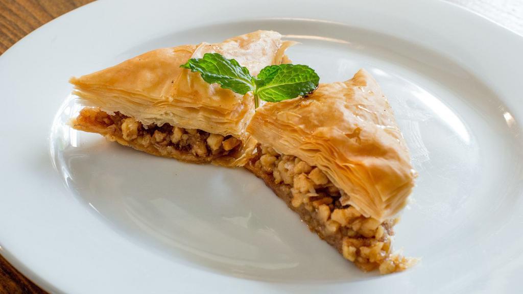 Walnut  Baklava · A traditional layered pastry dessert made of filo pastry and filled with walnuts. Sweetened with rose water syrup.