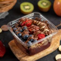 Acai Bowl · Blended acai, topped with strawberry, blueberry, banana, granola, and your choice of chocola...