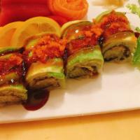 Dragon Roll · Eel, cucumber inside, topped with  avocado, eel sauce and  tobiko