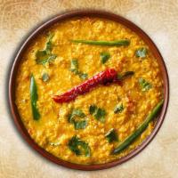Yellow Dal Tadka · Yellow lentils, slow cooked till thick and creamy and tempered with whole Indian spices