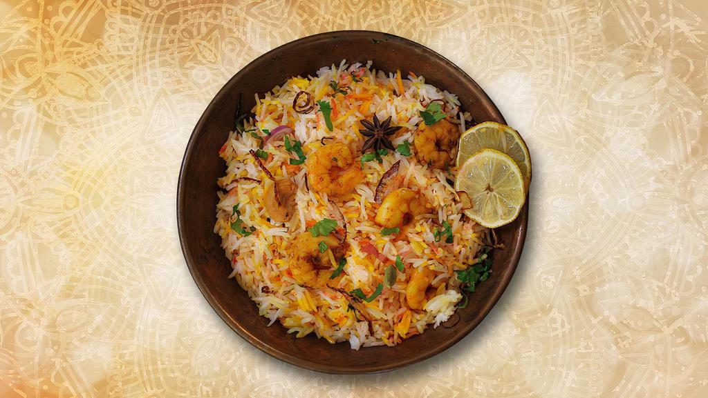 Classic Shrimp Biryani · Long grained rice flavored with fragrant spices flavored along with saffron and layered with shrimp and cooked with biryani masala gravy