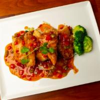 Pla Rad Prik · Double spicy. Fish fillet, spicy garlic sauce, bell peppers, and steamed broccoli.
