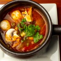 Tom Yum · Spicy. Hot and sour tangy soup, shrimp, and Thai herbs.