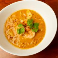 Massaman Curry · Coconut milk, potatoes, roasted peanuts, and onion.