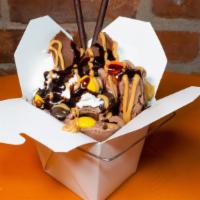 Peanut Delight · Chocolate Reese cup, Reese pieces, Reese and chocolate drizzle and wafer stick.