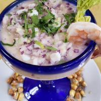 Leche De Tigre · Fresh minced fish marinated with freshly squeezed lime juice; infused with corn, minced onio...