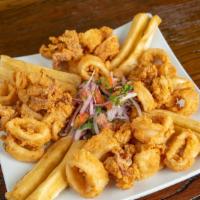 Fried Calamari · Batter-coated squid fried to crunchy perfection and accompanied by our famous green sauce dip.