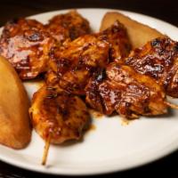 Anticuchos De Pollo · Peruvian  style brochettes cut  stew chicken on grill.  Served with boiled potatoes