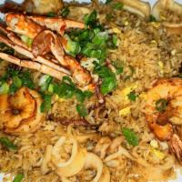 Chaufa De Mariscos · A Chinese-Peruvian seafood fried rice fusion. Accompanied with mussels, shrimps, calamari, a...