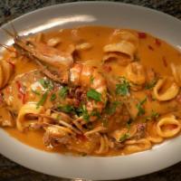 Pargo A Lo Macho (Red Snapper) · A whole red snapper with creamy calamari, mussels, shrimps and crab seafood sauce on top. Ac...