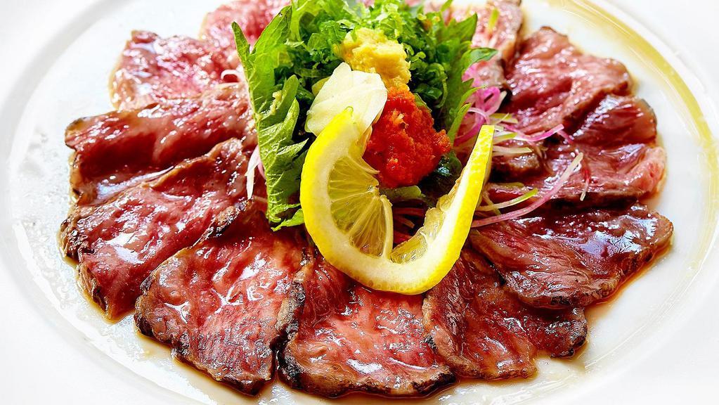 Wagyu Tataki With Ponzu · 2 oz thin sliced and lightly seared A5 wagyu sashimi with ponzu sauce.