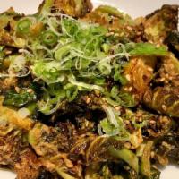 Crispy Brussels Sprouts · Tossed is sesame ponzu sauce with sesame seeds and scallions