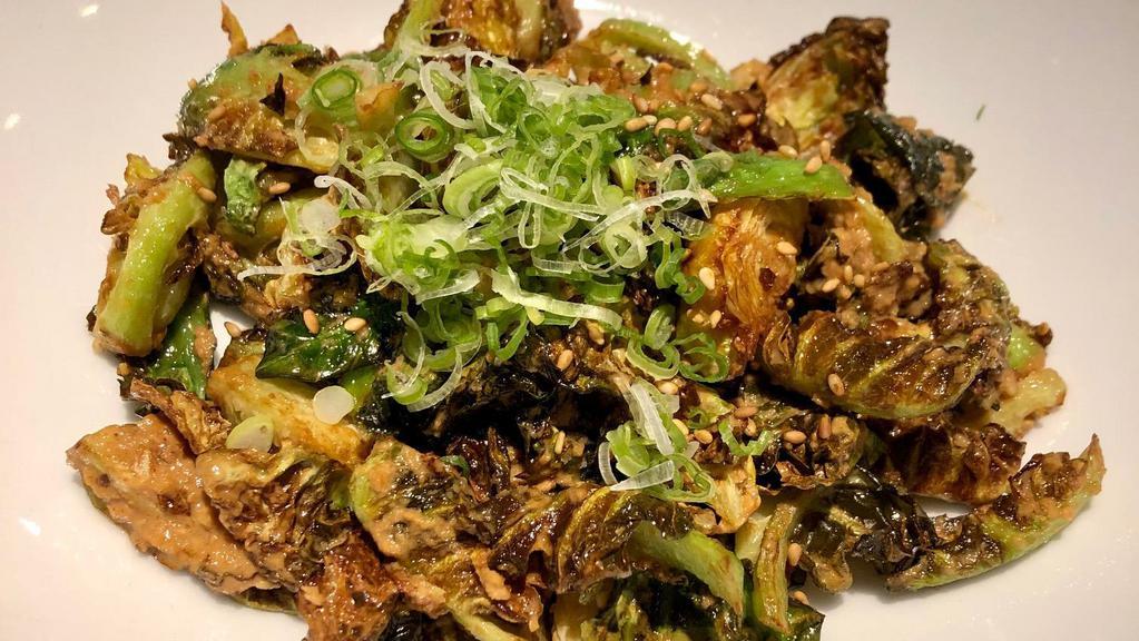 Crispy Brussels Sprouts · Tossed is sesame ponzu sauce with sesame seeds and scallions