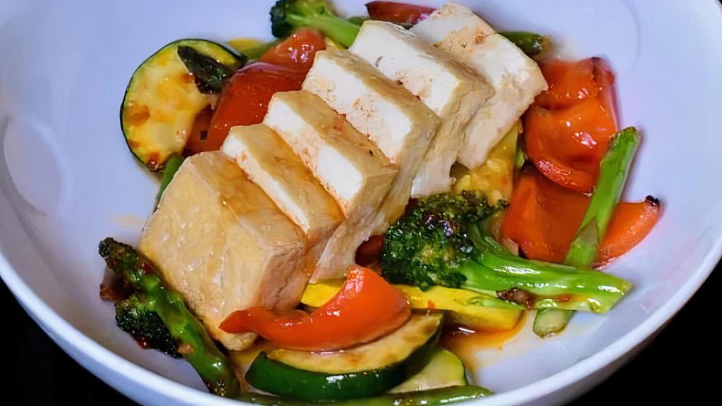 Tofu And Vegetables Spicy Garlic · Tofu and seasonal vegetable sauteed with spicy garlic sauce.