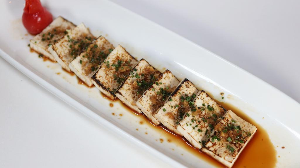 Tofu New Style · Tofu with yuzu soy, drizzled in hot sesame olive oil.