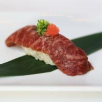 Japanese A5 Wagyu Sushi · 1 pc of Wagyu Sushi brushed with garlic soy sauce & lightly seared finished with ponzu, scal...