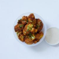 Cauliflower Side · Crispy, golden cauliflower tossed in our special shawarma spice blend. Served with creamy ta...