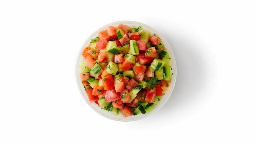 Israeli Salad · Freshly chopped tomatoes, cucumbers and parsley mixed with a lemon-mint dressing.