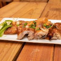 Roast Duck · Tender Duck Marinated In Our Island Blend Of Spices & Flame Roasted