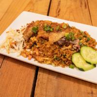 Mixed Fried Rice · Specialty Fried Rice, Stir Fried With Pork, Shrimp. Eggs, Mixed Vegetables & Topped With Tra...