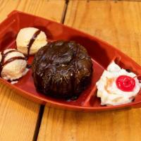 Sunken Chocolate Lava Boat · Warm Rich, Fudge Filled Chocolate Molten Lava Cake Drizzled With Hershey’s Chocolate Syrup, ...
