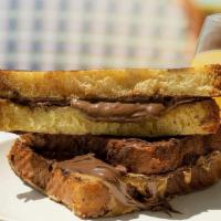 Le Peanut Butter And Nutella French Toast Sandwich · So good, it’s better than living rent-free in Versailles. Peanut butter and Nutella layered ...