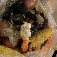 Combo B · 1 Whole Lobster (1.25lb), 3 Cluster of Snow Crabs, 1/2 lb Black Mussels, 1/2 Crawfish, 1 lb ...