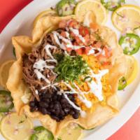 Crispy Tortilla Bowl · Meat, rice, beans, pico de gallo salsa mexicrema.