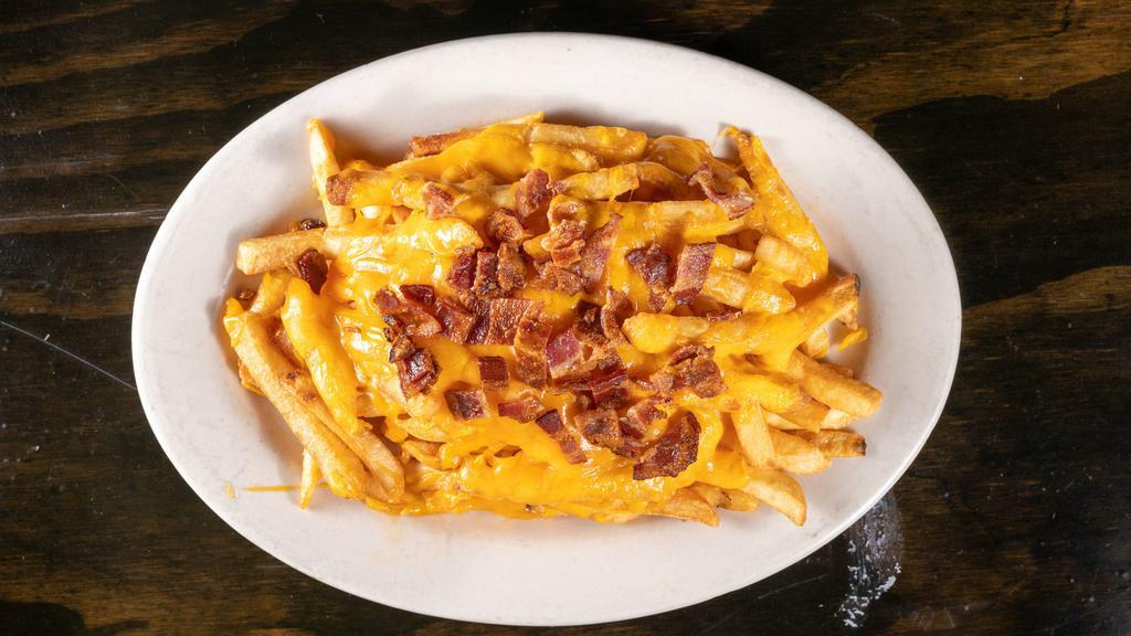 Loaded Fries · Melted cheddar cheese & chopped bacon bits. Served with ranch dressing